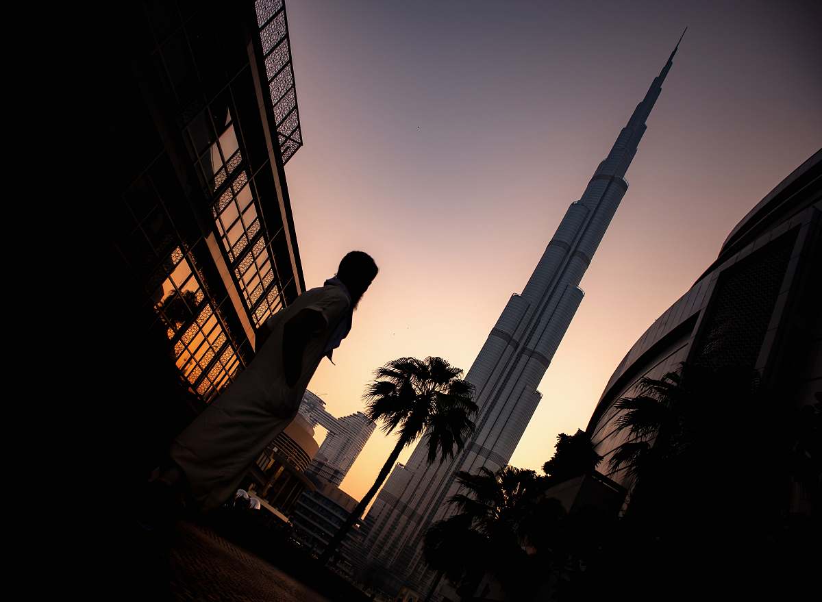 architecture person standing near tower tower