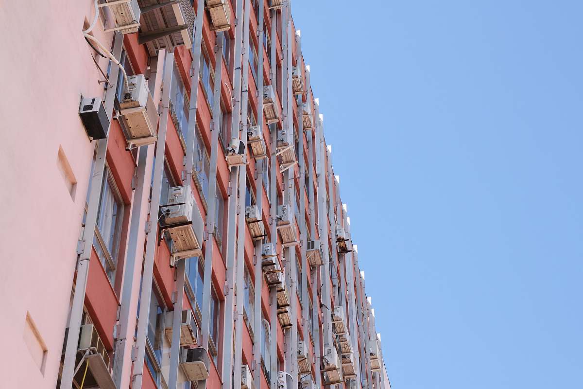 city pink and red concrete building during daytime high rise