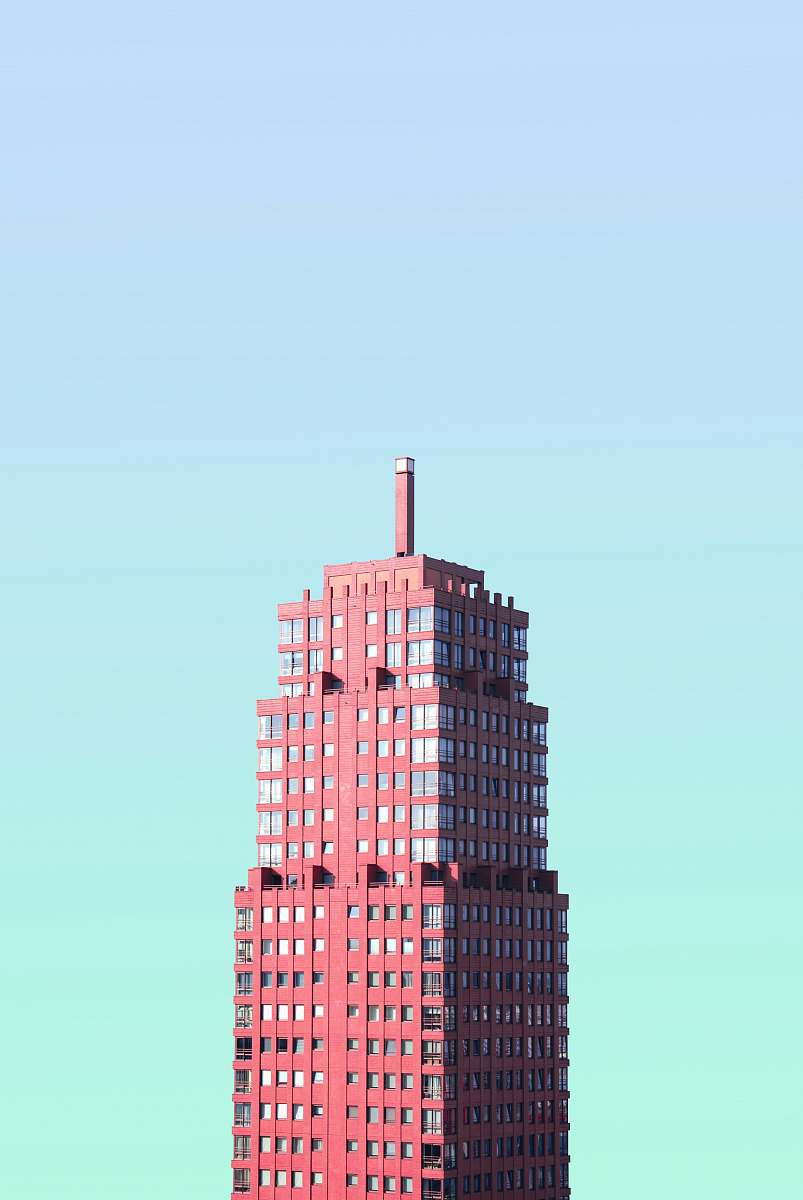 skyscraper red high-rise building under blue sky architecture
