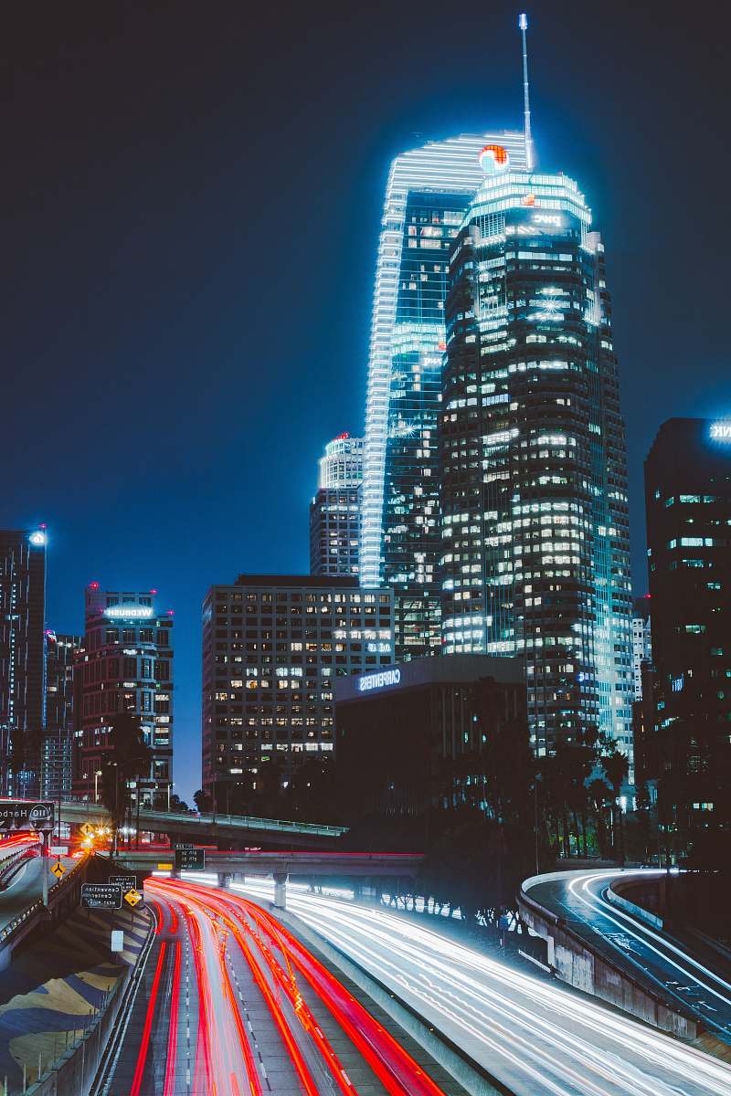 city time lapsed photography of vehicles beside buildings urban