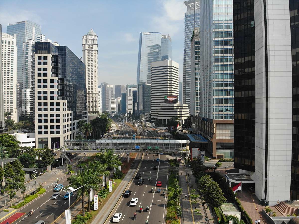 city vehicle beside concrete building during daytime road