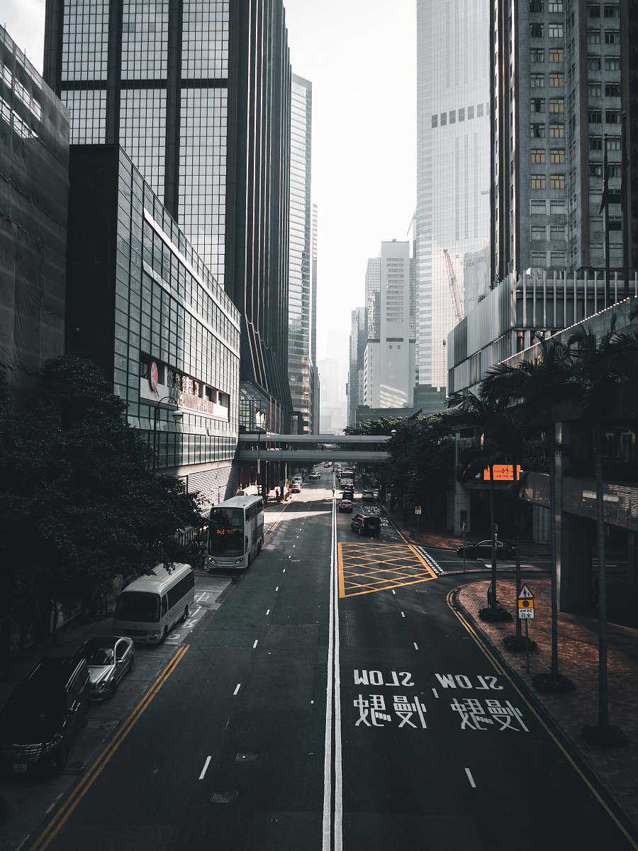 urban vehicle parked near building road