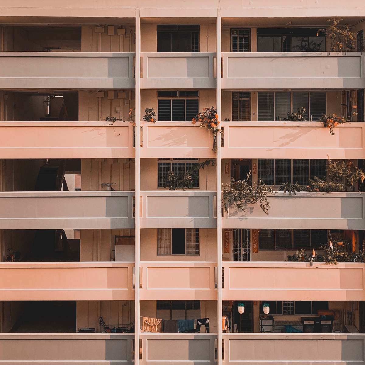 city view of beige painted apartment complex high rise