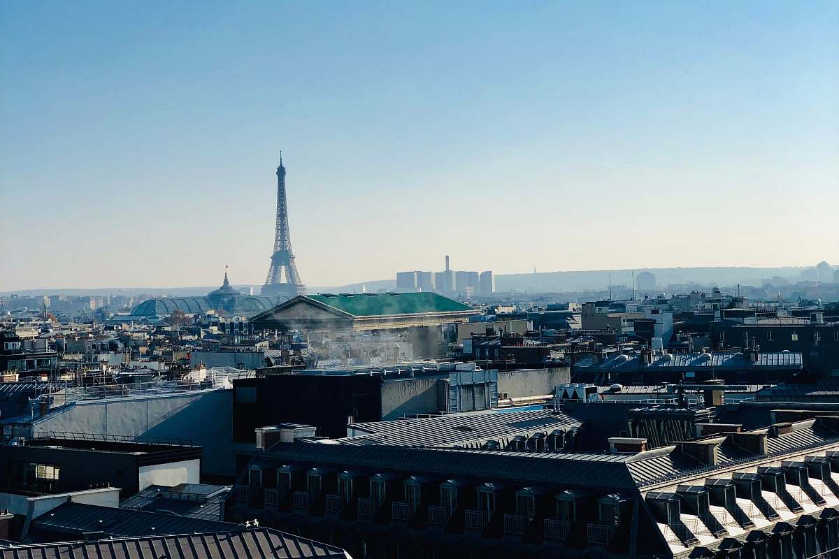 city view of Eiffel tower under blue sky metropolis