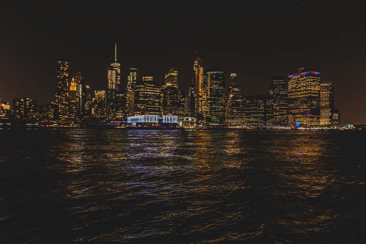 city wavy body of water at night metropolis