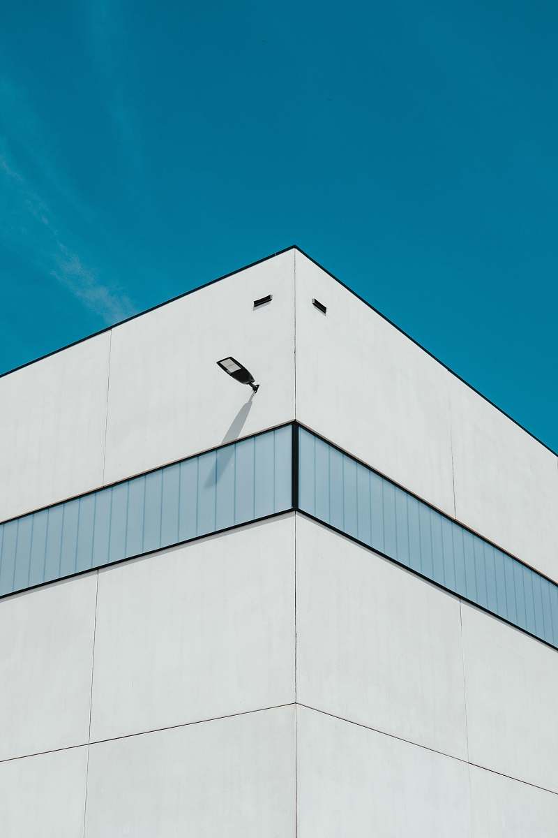 leuven white and green concrete building under blue sky belgium