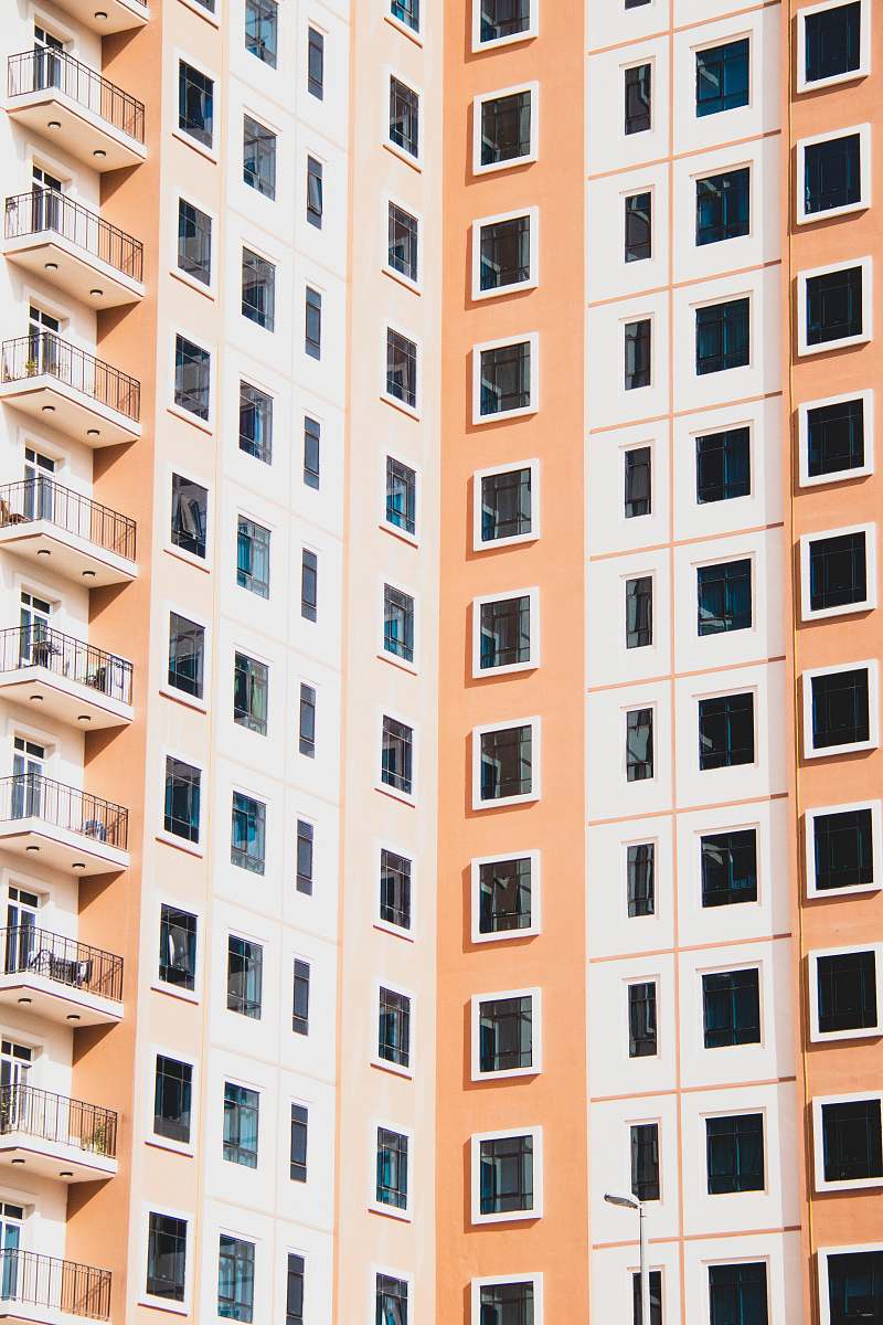 city white and yellow concrete building during daytime high rise