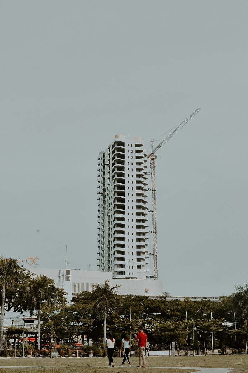 human white concrete building at daytime person