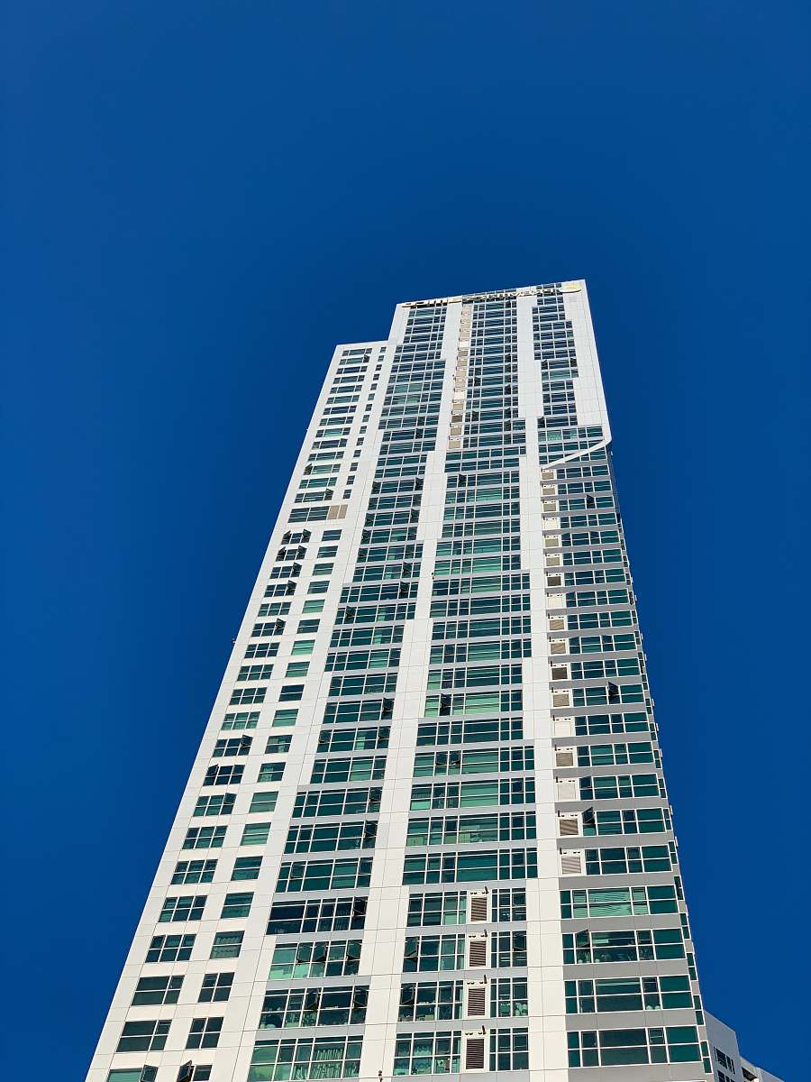 condo white high-rise building during day housing