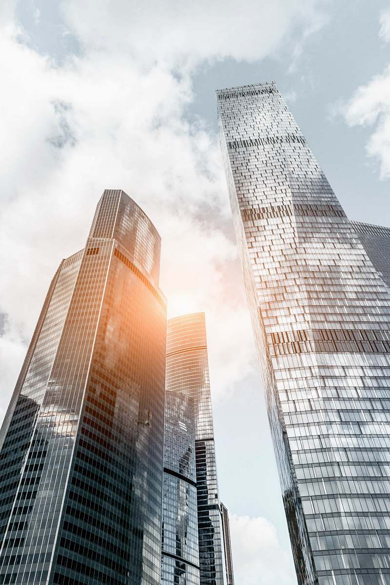 urban worm view photo of buildings under cloudy sky during daytime city