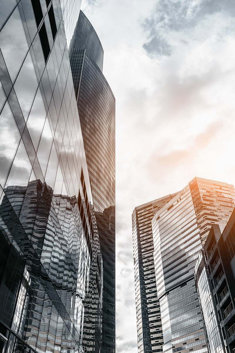 city worm view photo of city buildings under cloudy sky urban