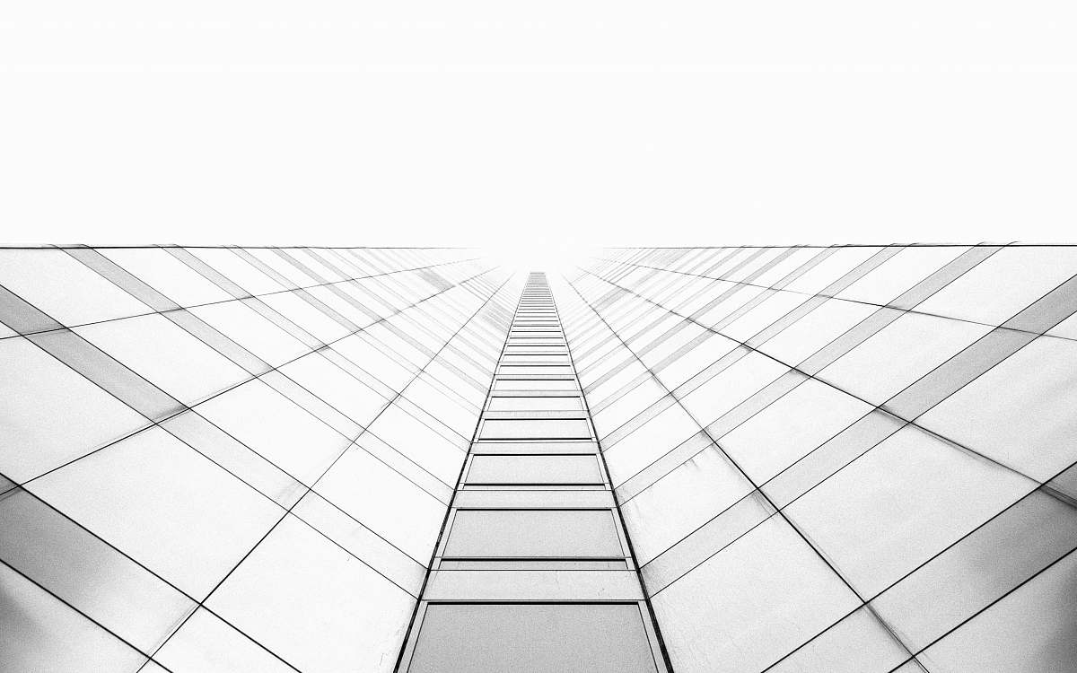 black-and-white worm's eye view photography of high-rise building white