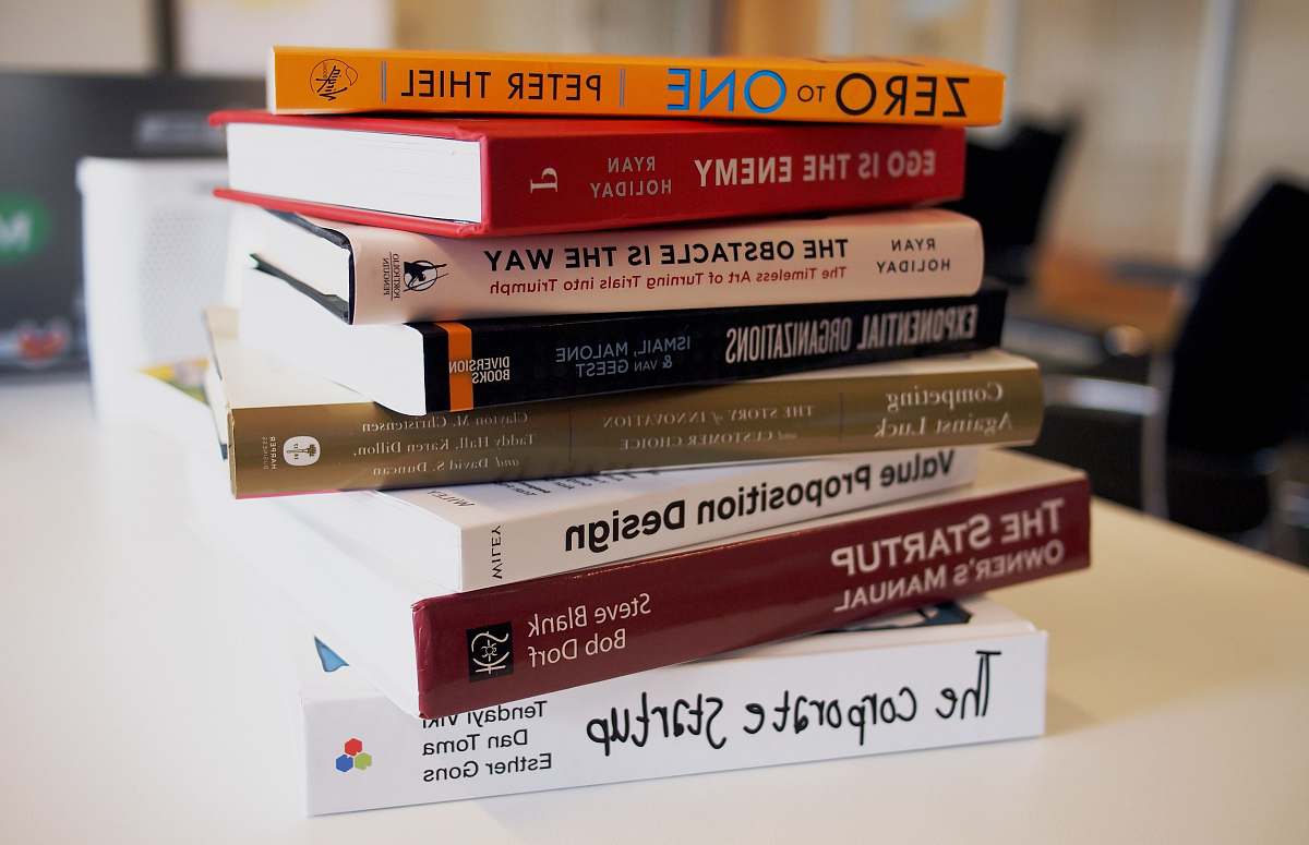 book pile of assorted-title books startup