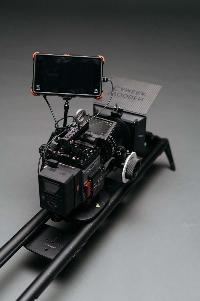 display black flat screen monitor attached to camera on rail machine