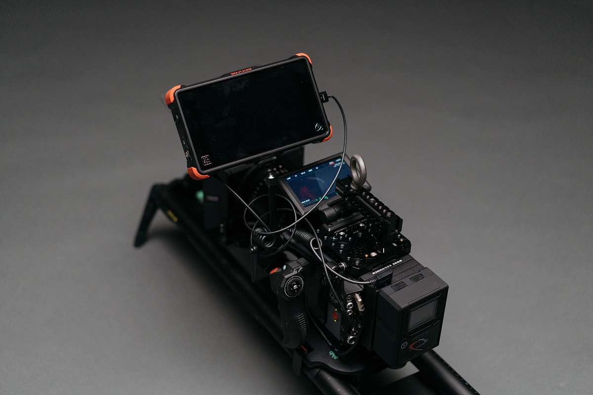 electronics black smartphone attached to camera machine