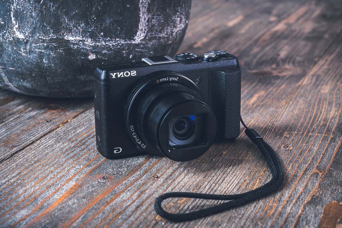 strap black Sony digital camera on table electronics