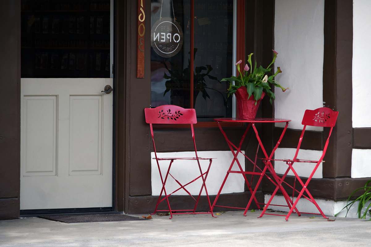 furniture bistro set near closed door shelf