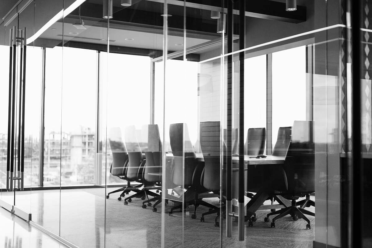 office grayscale photography of corporate room black-and-white