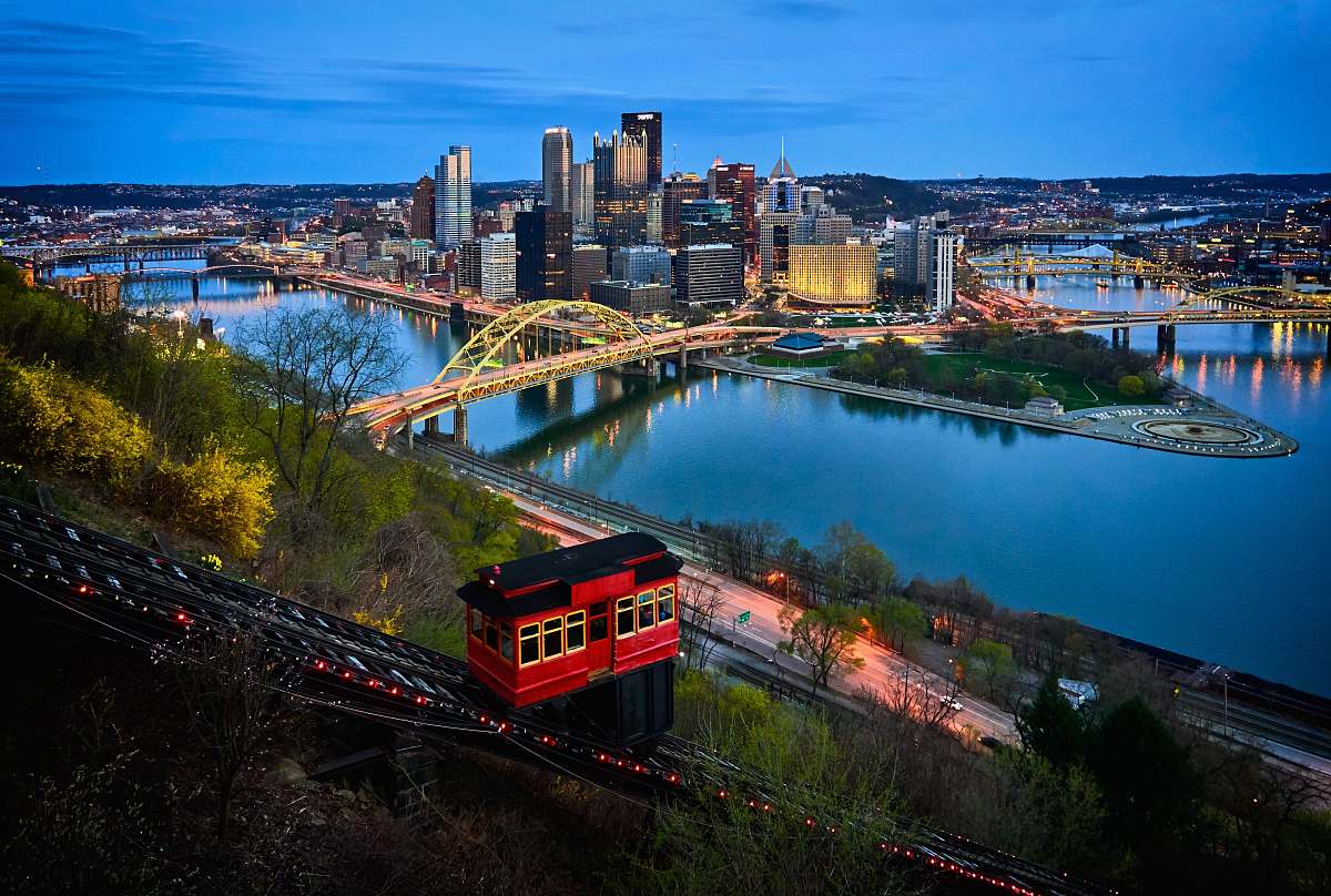 urban aerial photo of bridge and buildings under blue sky nature
