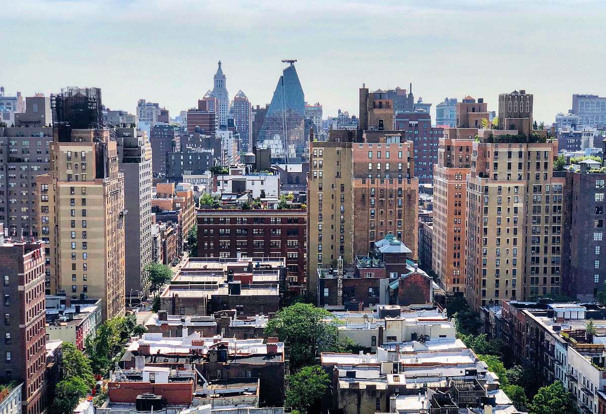 building brown concrete buildings during daytime town
