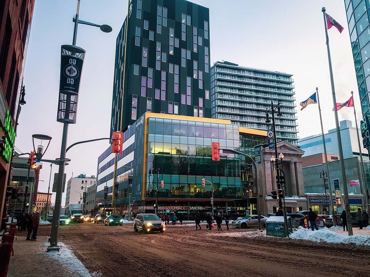 urban cars on road near building during daytime downtown
