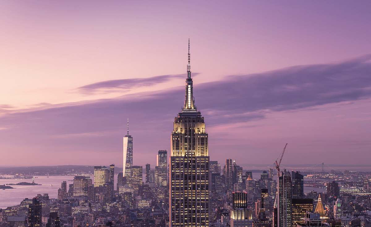 building cityscape under purple sky high rise