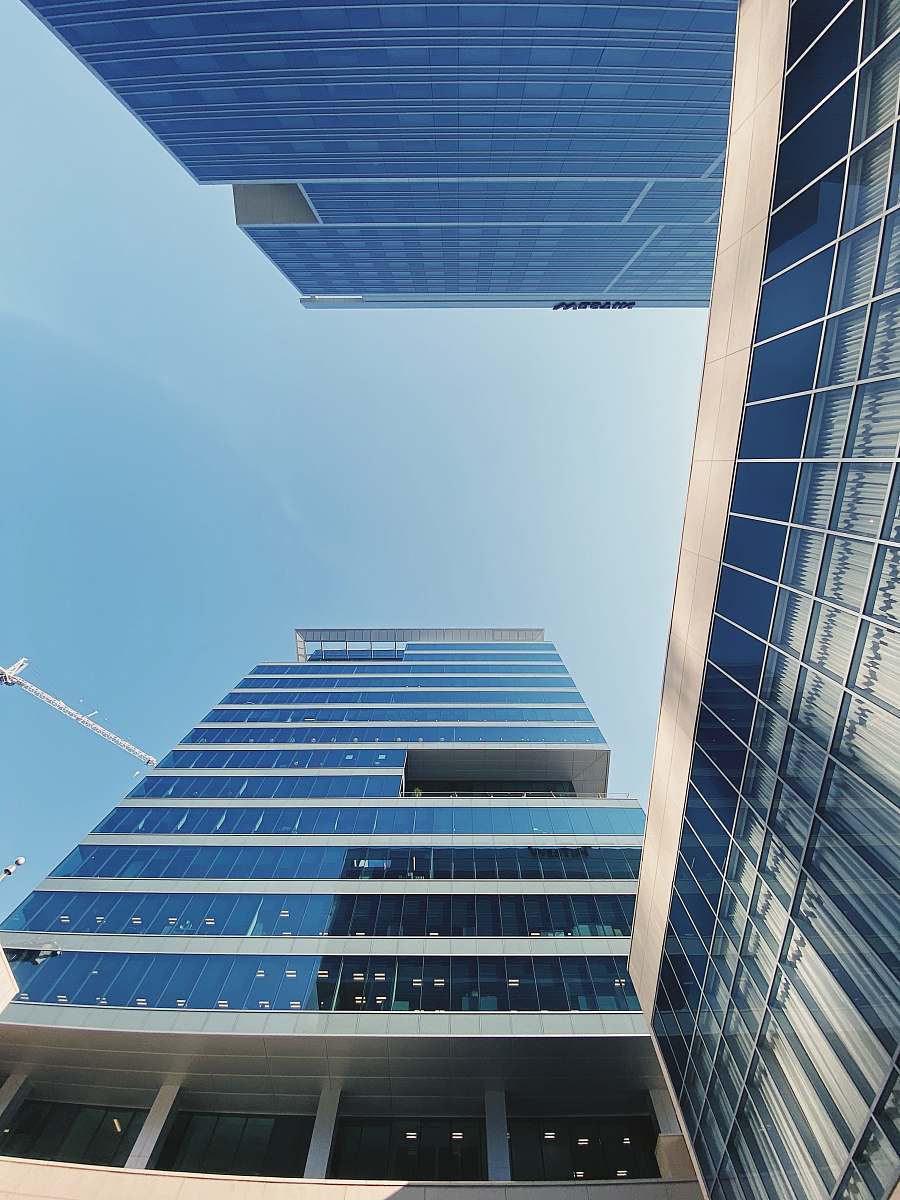 building gray and blue glass panel building office building