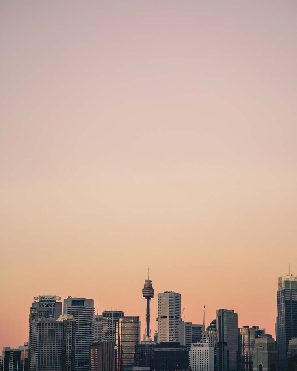 urban high rise building under orange skies skyscraper