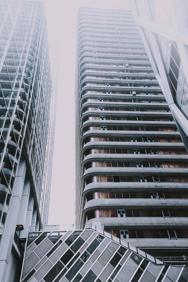 building high-top gray concrete buildings during daytime high rise