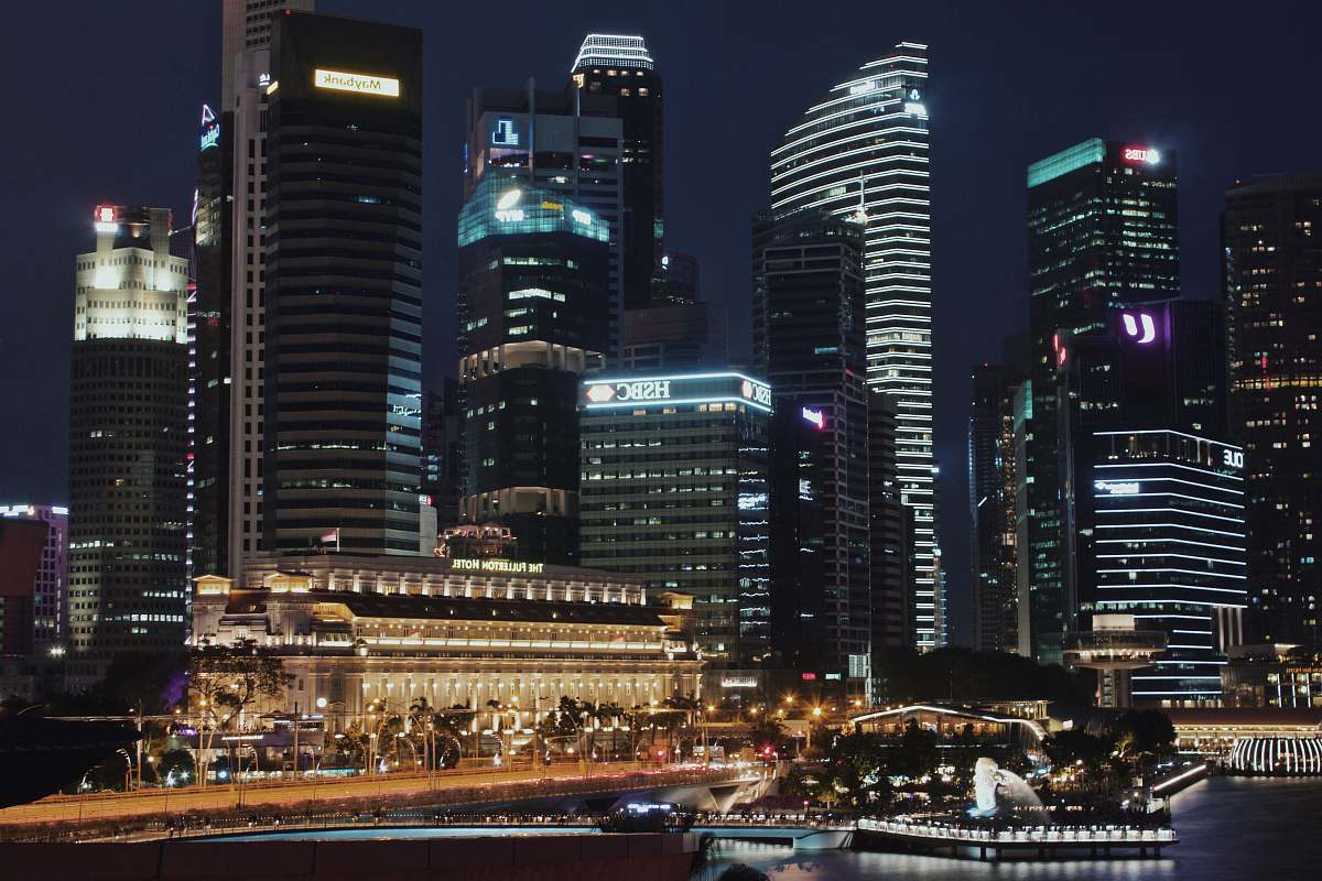 building lighted city skyline at night time town