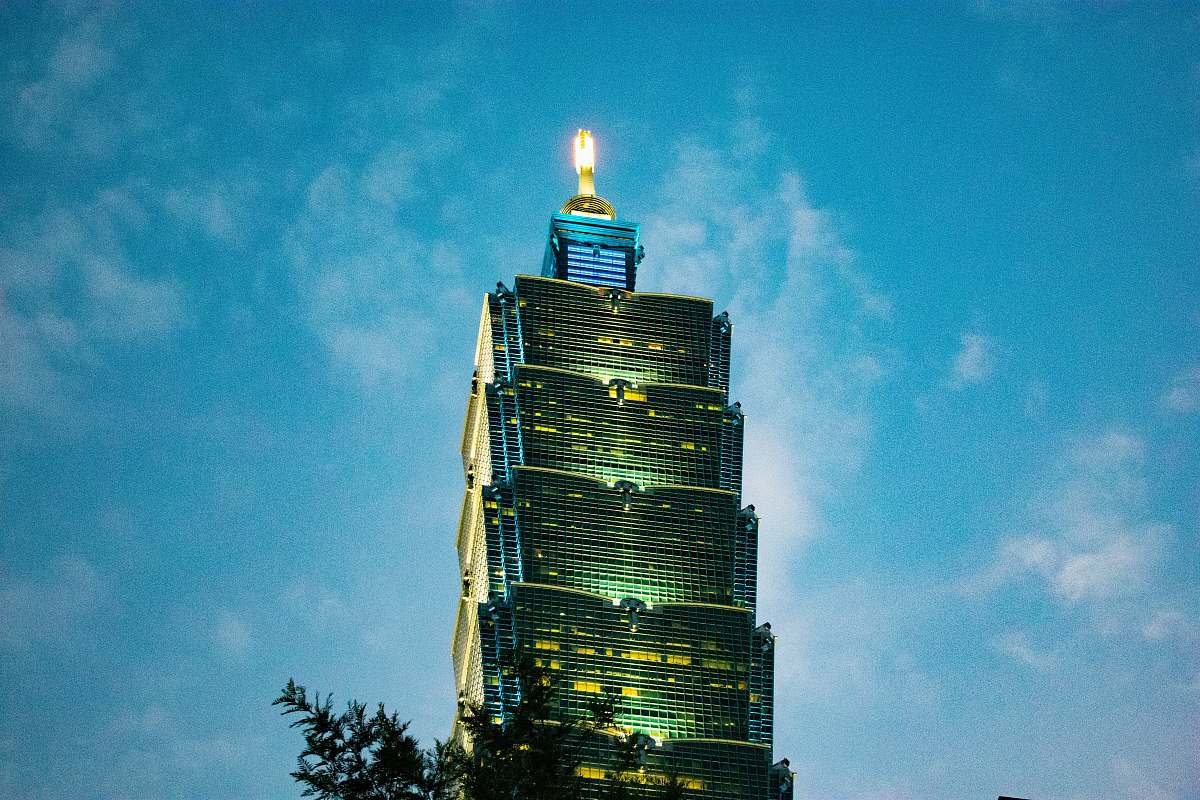 building low angle photo of lighted building high rise