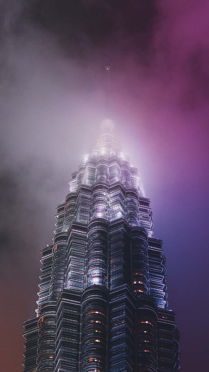 architecture low-angle photography of grey high rise building tower