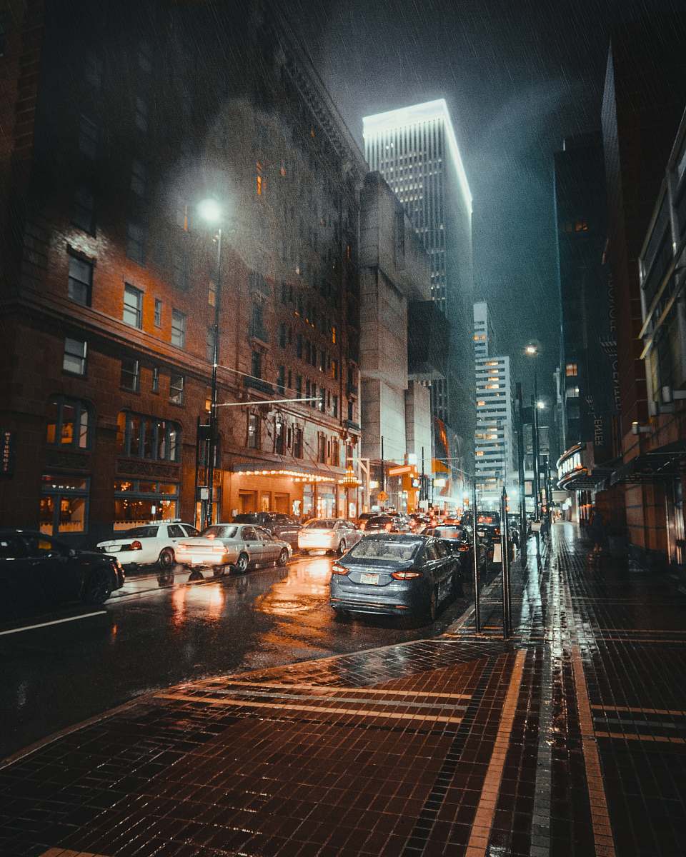 urban vehicles parked on road at night car