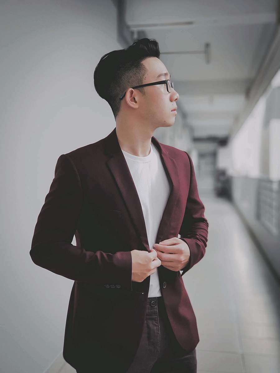 apparel man buttoning his maroon formal suit jacket suit