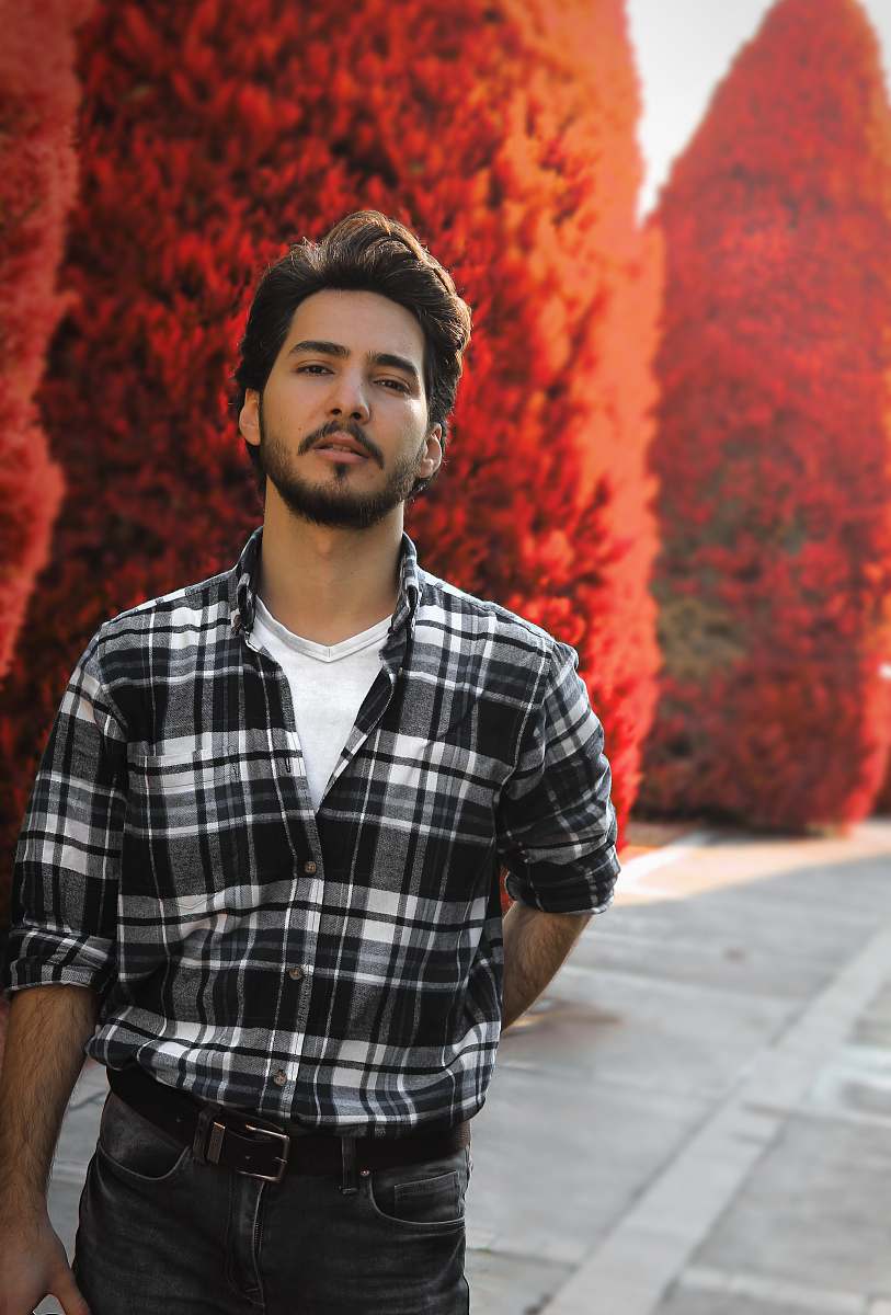 apparel man wearing black and white plaid button-up shirt shirt