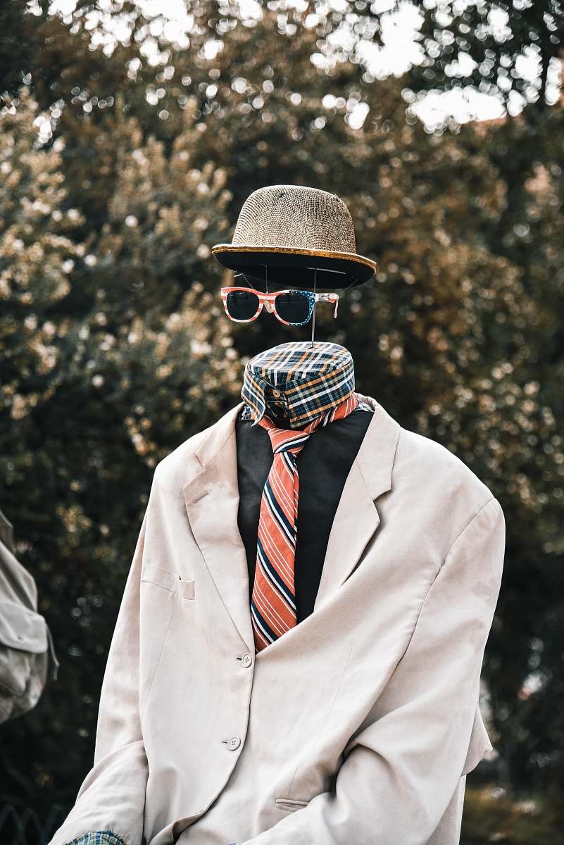 apparel necktie, hat, and sunglasses hat