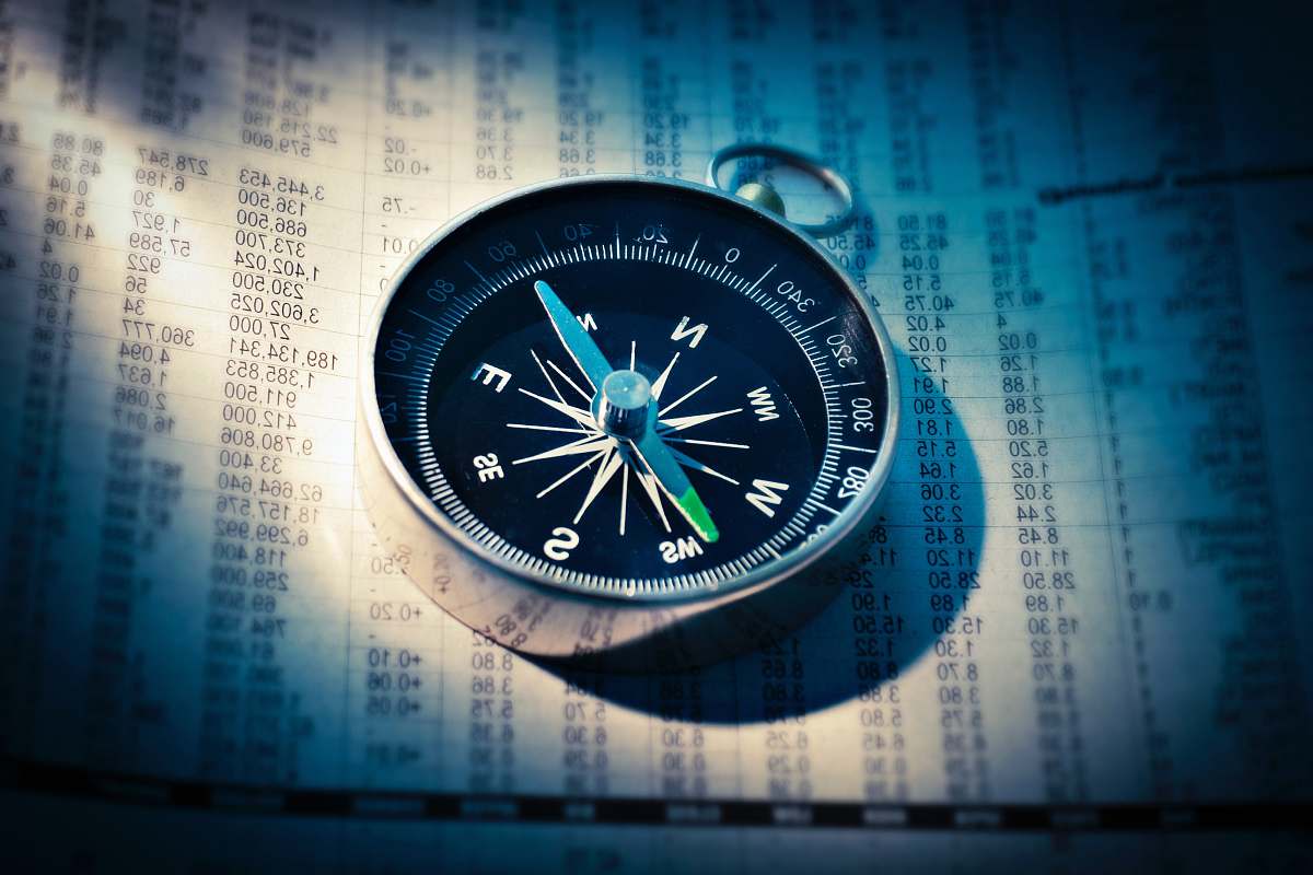 fund shallow focus photograph of black and gray compass stock exchange
