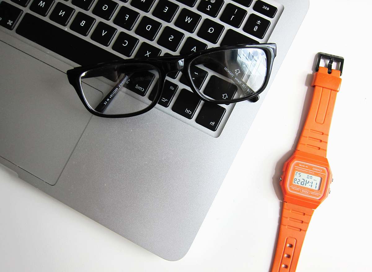 electronics eyeglasses with black frame on MacBook Air keyboard