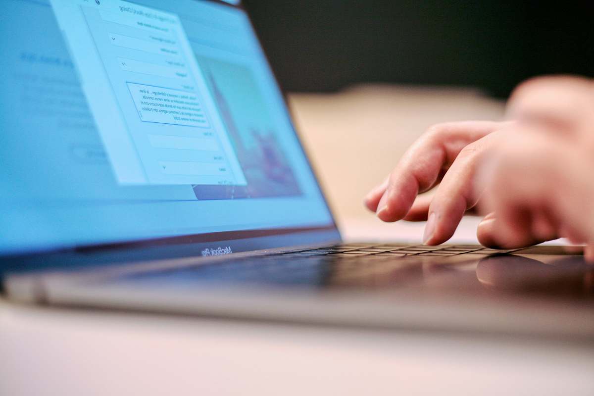 laptop person using MacBook Pro electronics