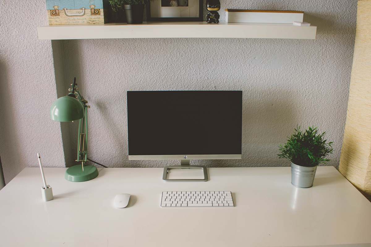 grey silver iMac with Apple Magic Keyboard and Mouse on white table valladolid