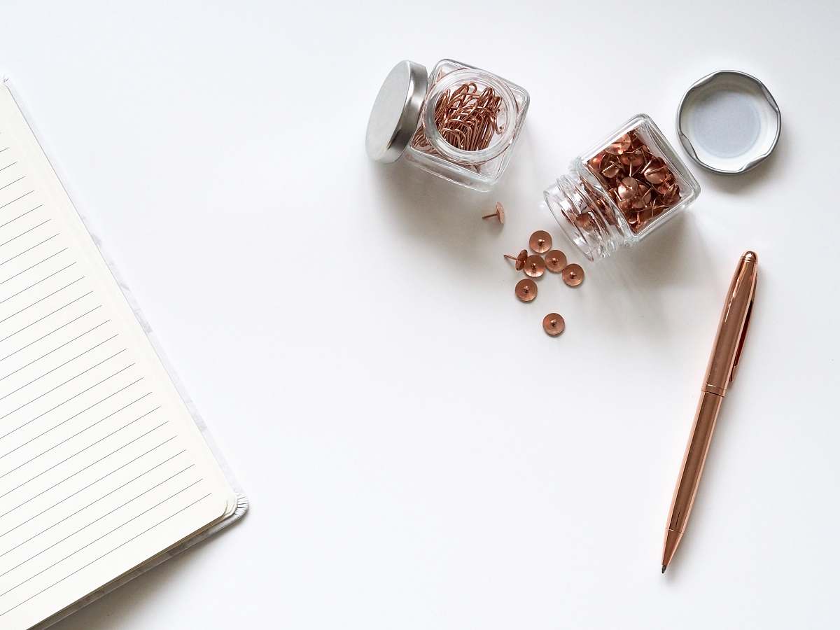 office stainless steel twist pen beside clear glass jars blog