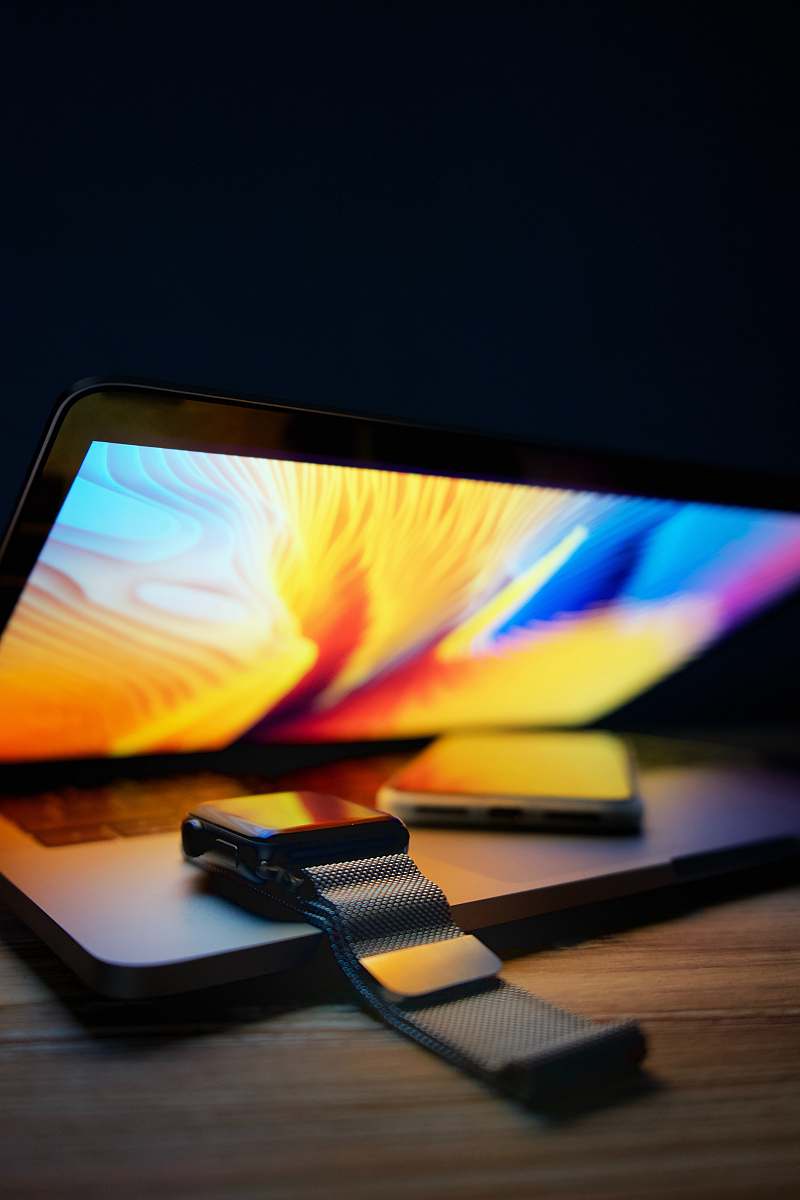 electronics Apple Watch and MacBook Pro monitor
