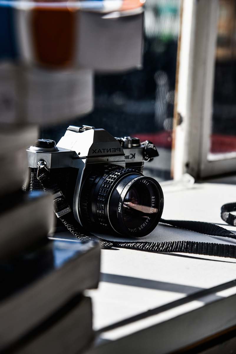 camera black Pentax camera on opened window black