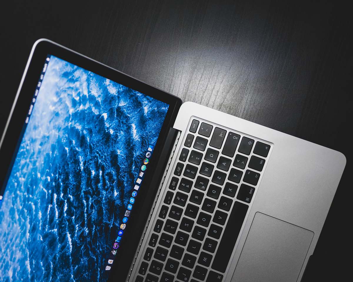 keyboard MacBook Pro on black wooden table laptop