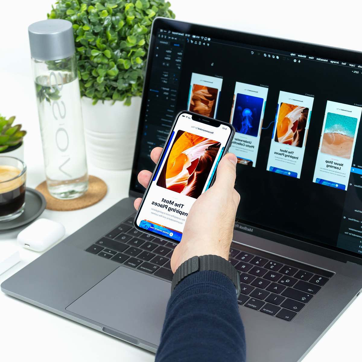 keyboard person holding iPhone turned on computer