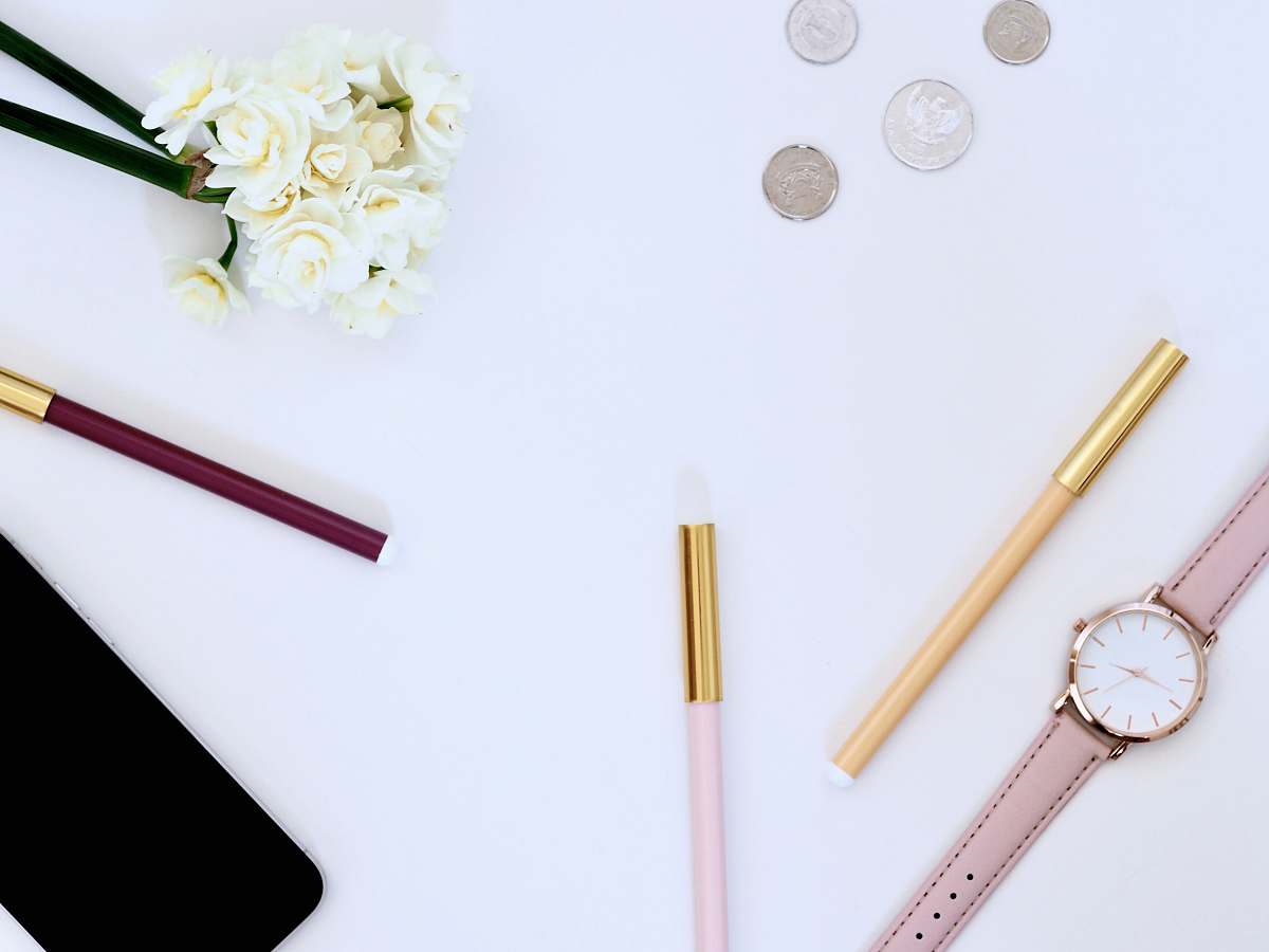desktop flat lay photo of watch on top of table money