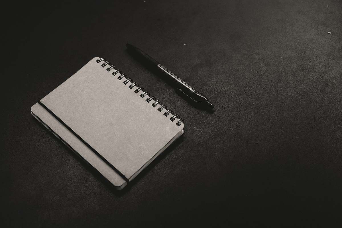 bandung black click pen beside notebook indonesia