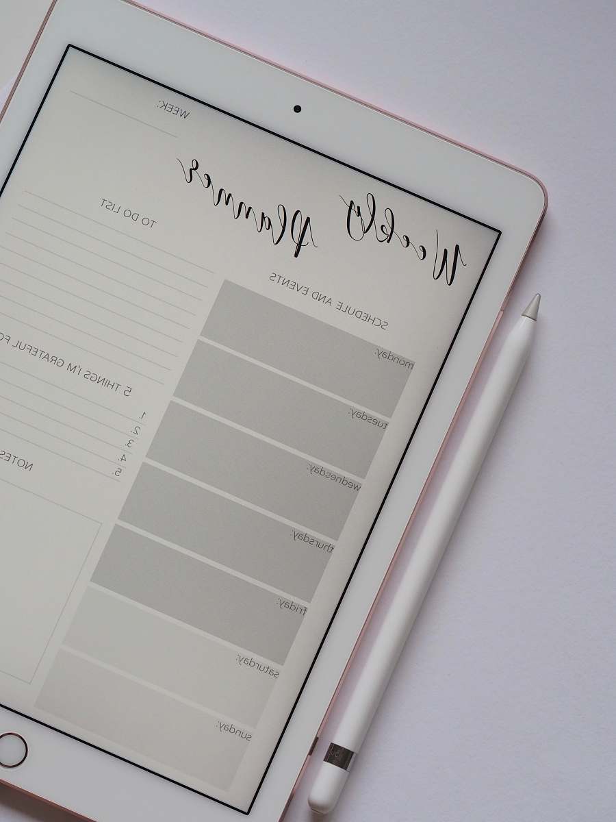 blog flat lay photography of turned-on silver iPad beside Apple Pencil office
