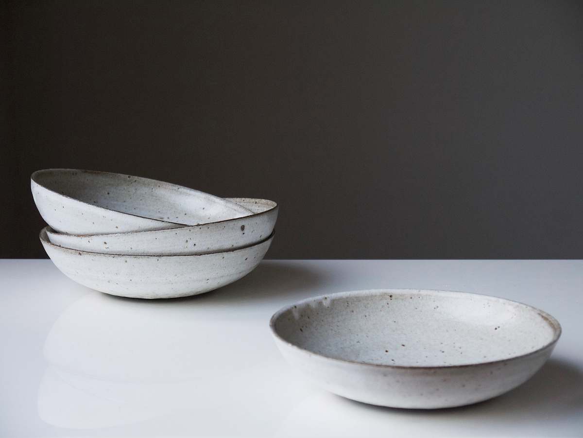 bowl four round white ceramic bowls on white surface turning earth ceramics