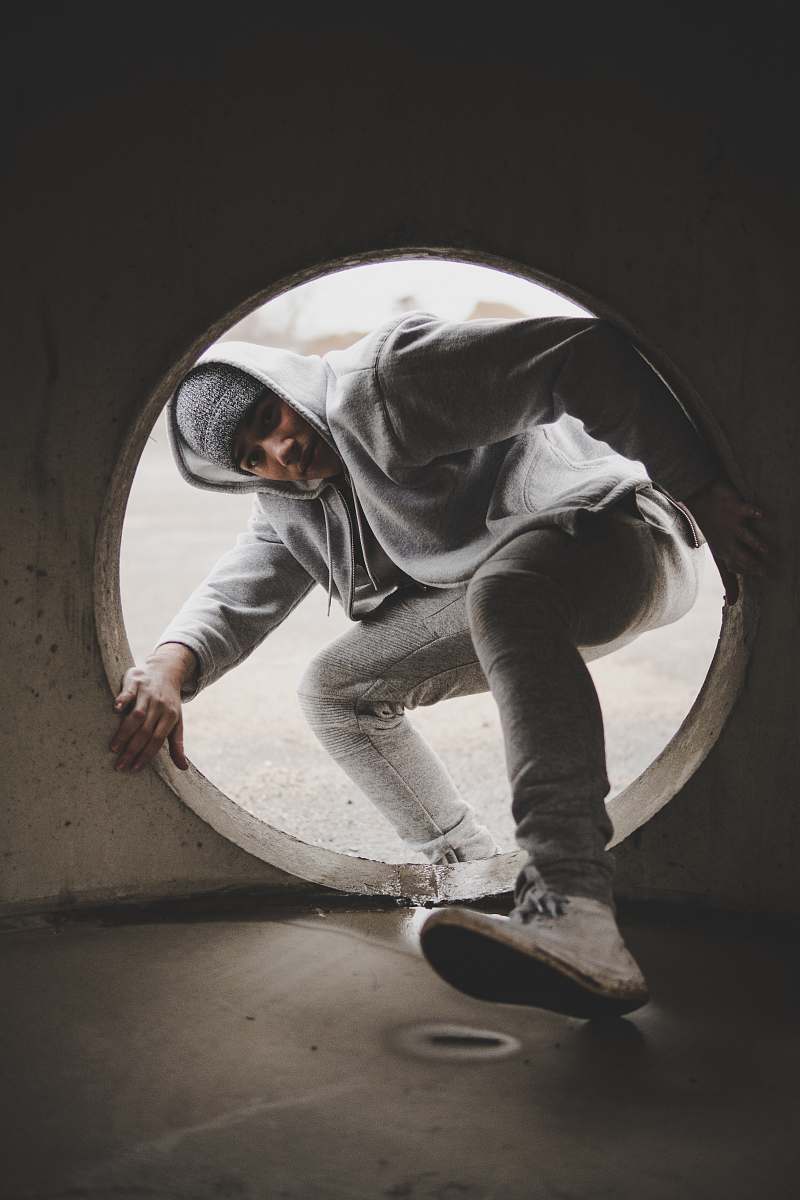 person man entering hole human